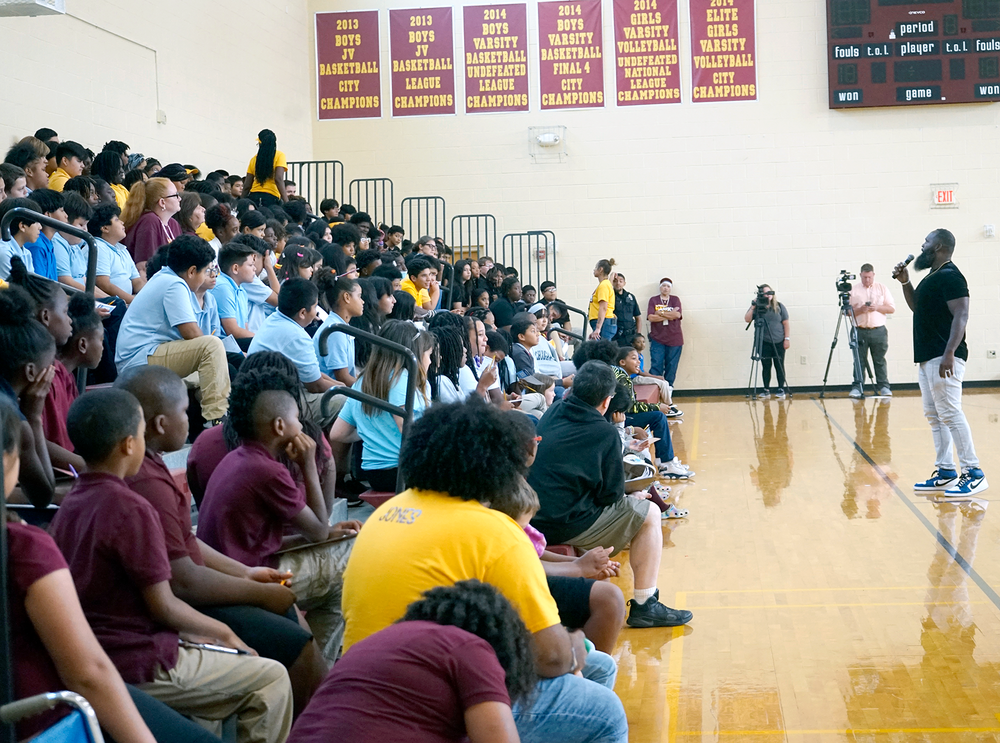 person talking to a crowd of students